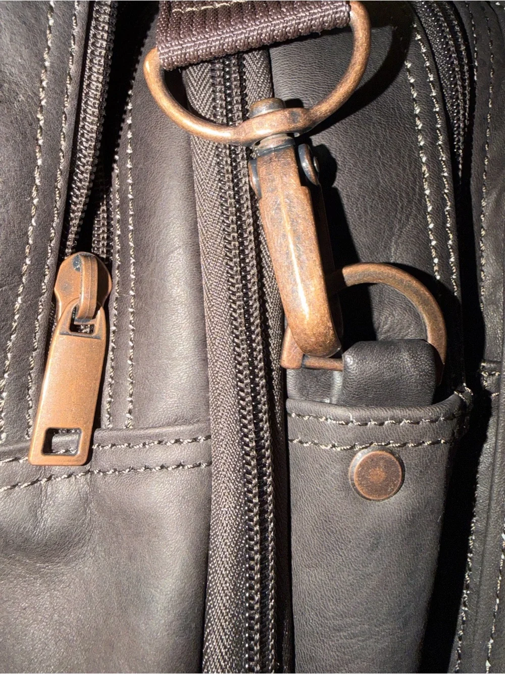Wilson Leather dark brown leather expandable multi pocket laptop travel bag.